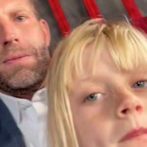 Eric and Luke Trump on a military helicopter.