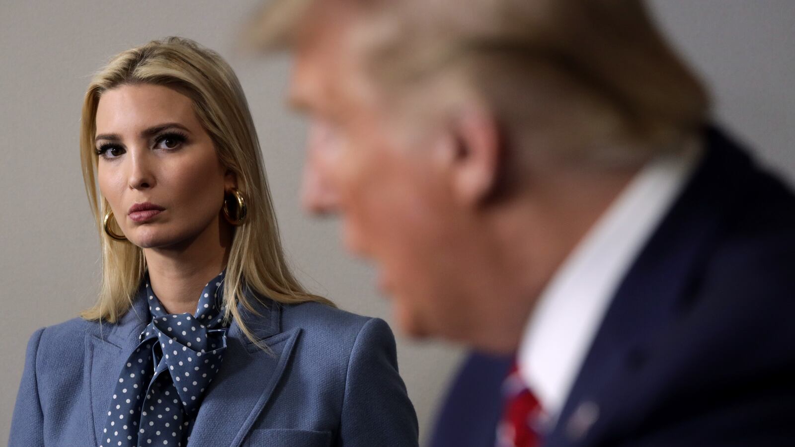 U.S. President Donald Trump speaks as his daughter and senior adviser Ivanka Trump looks on
