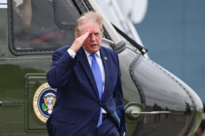 U.S. President Donald Trump salutes after disembarking Marine One at Morristown Municipal Airport in Morristown, New Jersey, U.S., August 2, 2026.