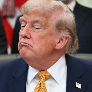 US President Donald Trump looks on after signing an executive order in the Oval Office of the White House in Washington, DC, on June 22, 2026.