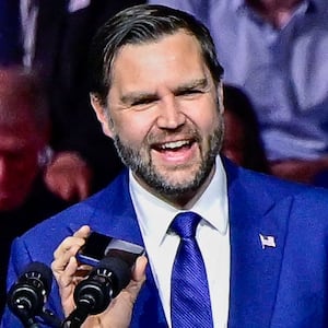 U.S. Vice President JD Vance speaks with U.S. President Donald Trump on a phone as he delivers remarks at a Day of Friendship event with Hungary's Prime Minister Viktor Orban at MTK Sportpark in Budapest, Hungary, April 7, 2026. REUTERS/Marton Monus