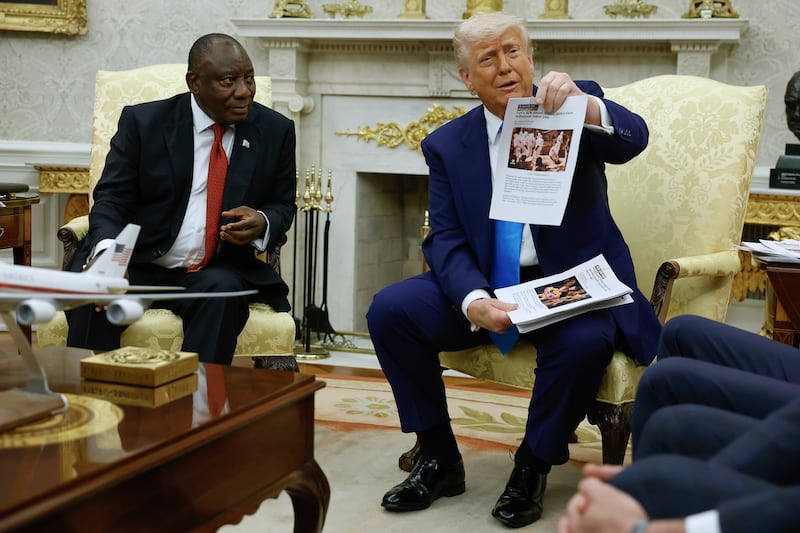 Trump confronted the South African leader with a pile of printed materials during a chaotic Oval Office meeting.