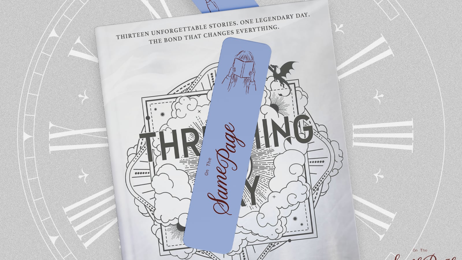 A light blue "On The Same Page" bookmark with a line drawing of a person reading rests on a gray and white book cover featuring clouds, a dragon, and the tagline "Thirteen unforgettable stories. One legendary day." A clock face fills the background.