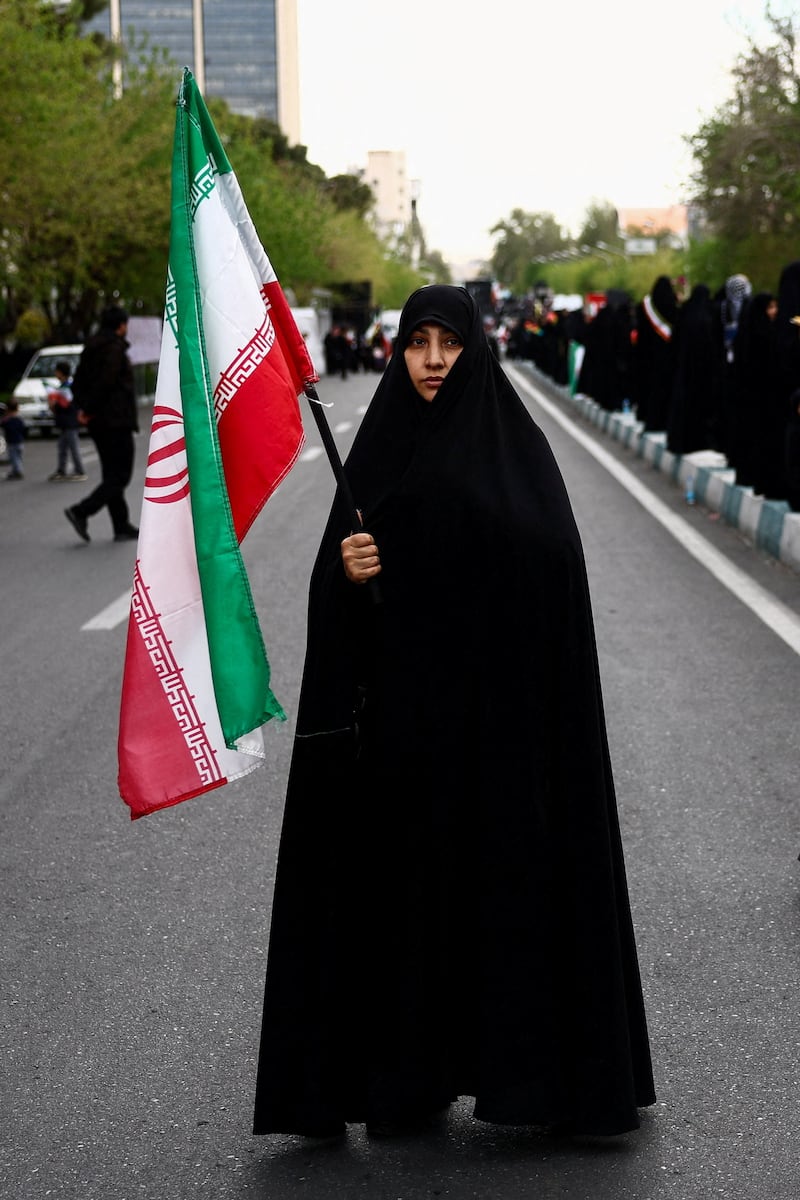 An Iranian woman attends a ceremony marking 40 days since schoolchildren were killed in a strike on a girls' primary school in Minab, amid the U.S.-Israeli conflict with Iran, in Tehran, Iran, April 7, 2026.