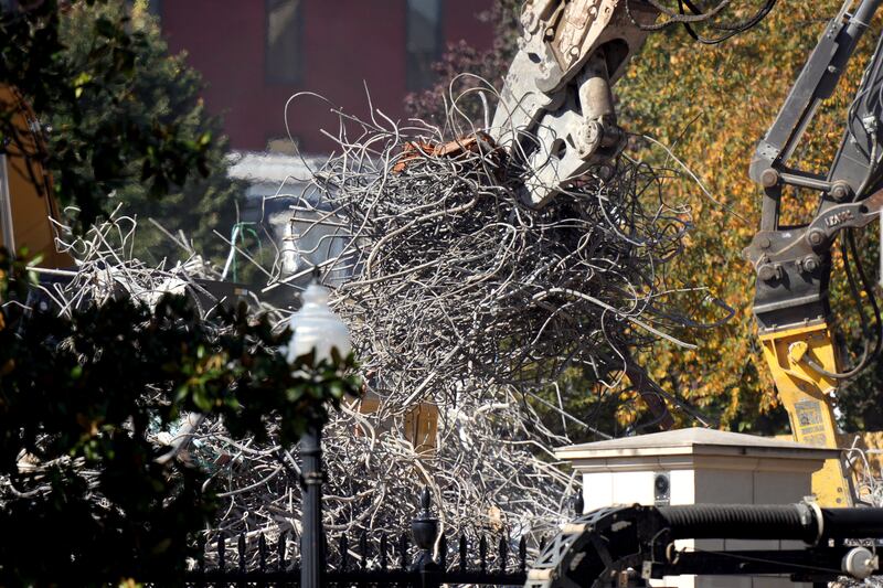 An excavator works to clear rubble after the East Wing of the White House was demolished on October 23, 2025 in Washington, DC.
