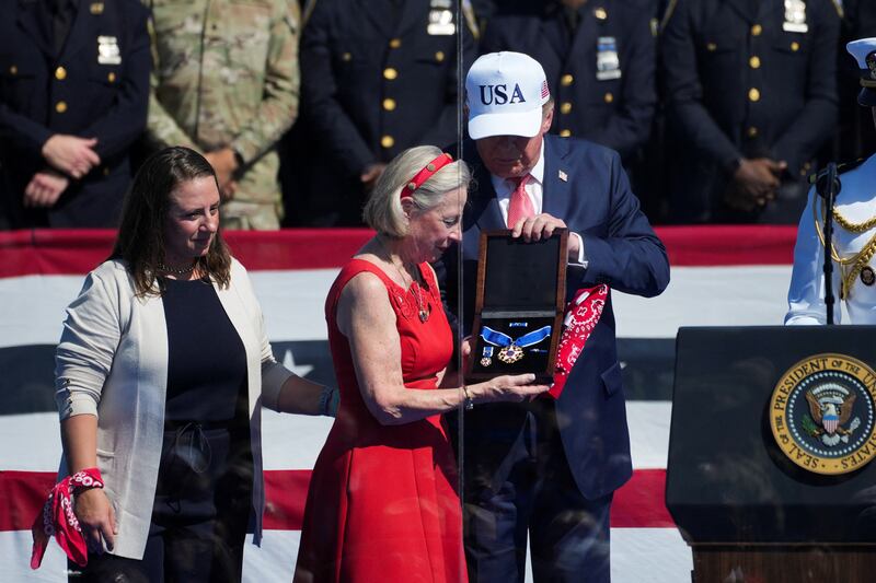 Donald Trump presents the Presidential Medal of Freedom to Alison Crowther, on behalf of her son Welles Remy Crowther.