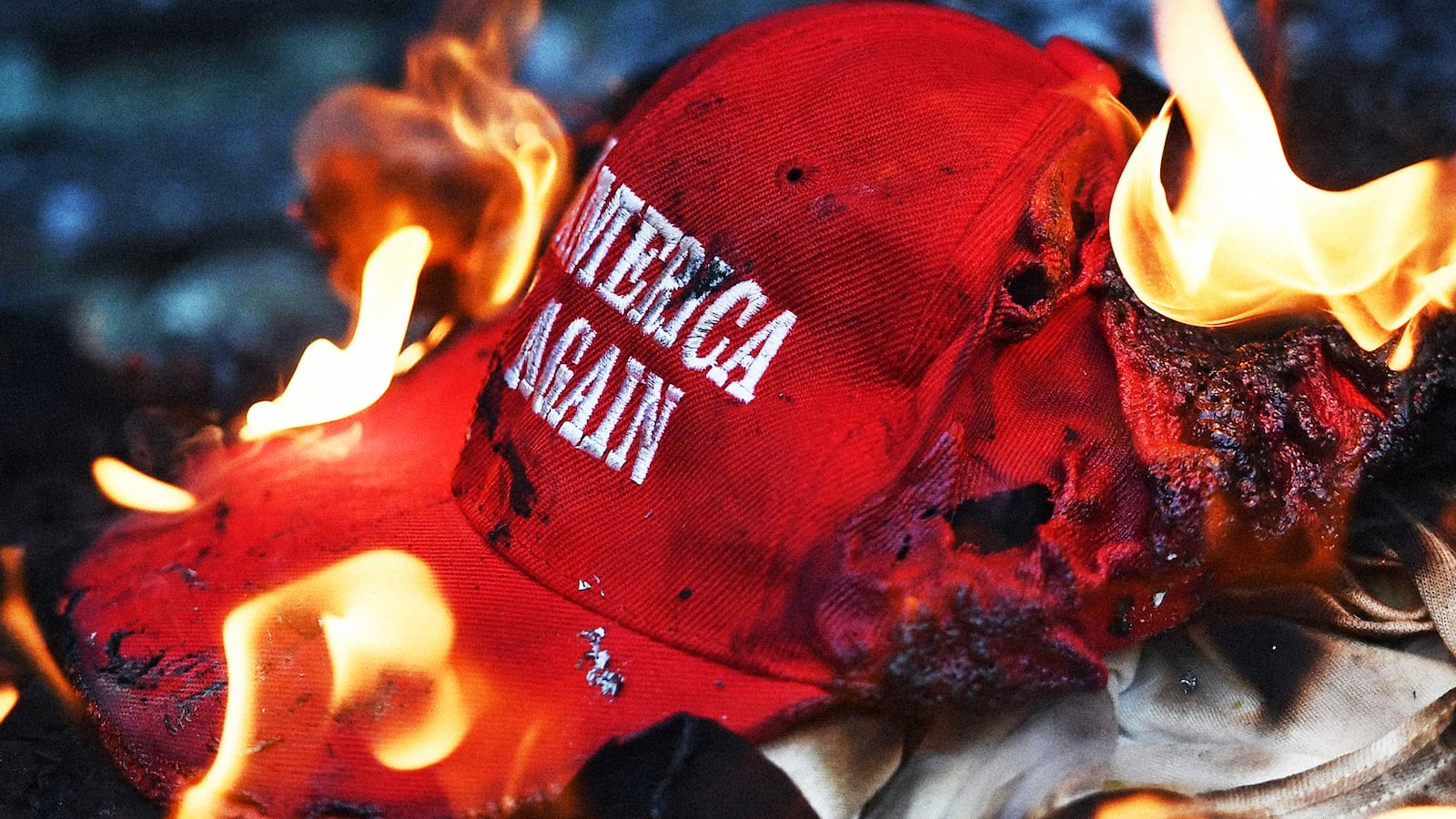 A "Make America Great Again" hat on fire.