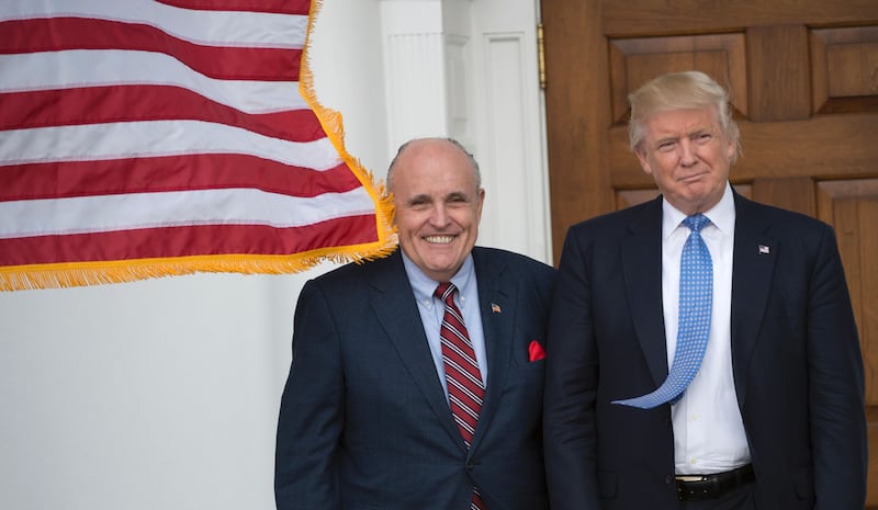 President-elect Donald Trump meets with former New York City Mayor Rudy Giuliani at the clubhouse of Trump National Golf Club November 20, 2016 in Bedminster, New Jersey. / AFP / Don EMMERT (Photo credit should read DON EMMERT/AFP via Getty Images)