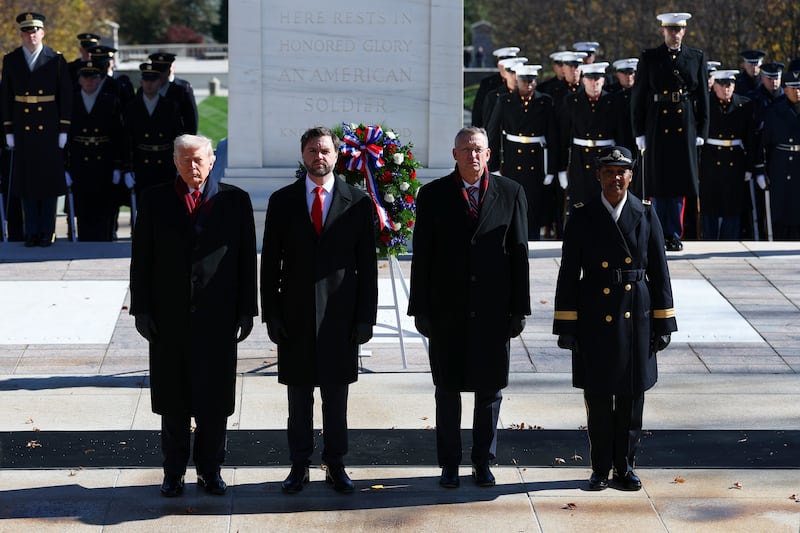 (L-R) U.S. President Donald Trump, U.S. Vice President JD Vance, U.S. Secretary for Veterans Affairs Doug Collins and Brig. Gen. Antoinette Gant, Commanding General, Military District of Washington participate in a wreath-laying ceremony at The Tomb of the Unknown Soldier at Arlington National Cemetery to mark Veterans Day on November 11, 2025 in Arlington, Virginia. Members of the Trump administration visited Arlington National Cemetery to observe the federal holiday honoring military service members. (Photo by Anna Moneymaker/Getty Images)