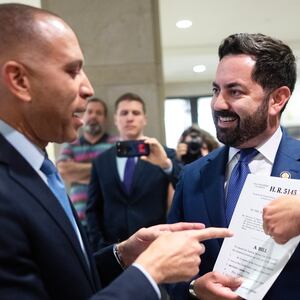 Rep. Mike Lawler, R-N.Y.,  right, confronts House Minority Leader Hakeem Jeffries, D-N.Y., about signing on to a bill that would extend Affordable Care Act tax credits, after a House Democrats news conference in the Capitol Visitor Center on on Oct. 8, 2025.