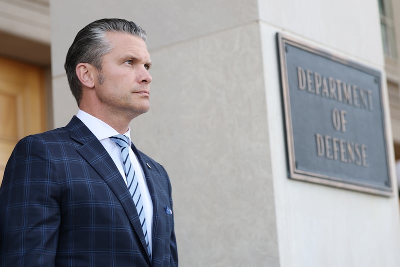 U.S. Secretary of Defense Pete Hegseth stands outside the Pentagon .