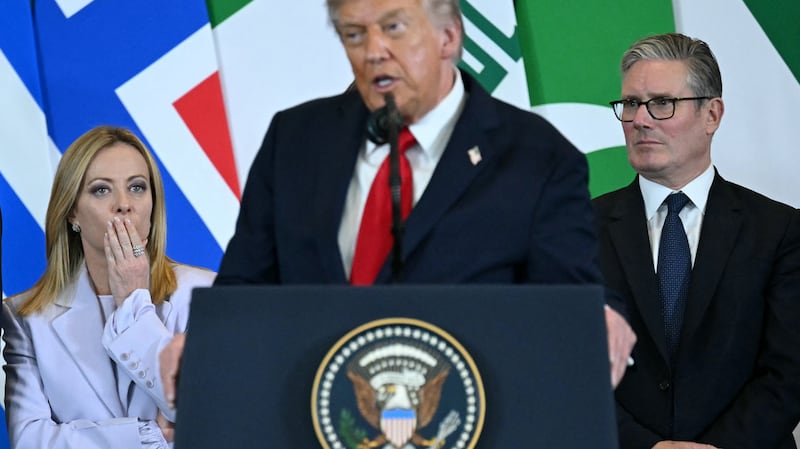 US President Donald Trump (C) speaks as Italian Prime Minister Giorgia Meloni (L) and Britain's Prime Minister Keir Starmer watch during the Sharm El-Sheikh Peace Summit in the Egyptian Red Sea resort town of Sharm el-Sheikh on October 13, 2025. Trump on October 13 hailed a Gaza summit in Egypt as a "tremendous day" for the Middle East, saying a document would be signed on "rules and regulations" for future talks. (Photo by SAUL LOEB / AFP) (Photo by SAUL LOEB/AFP via Getty Images)