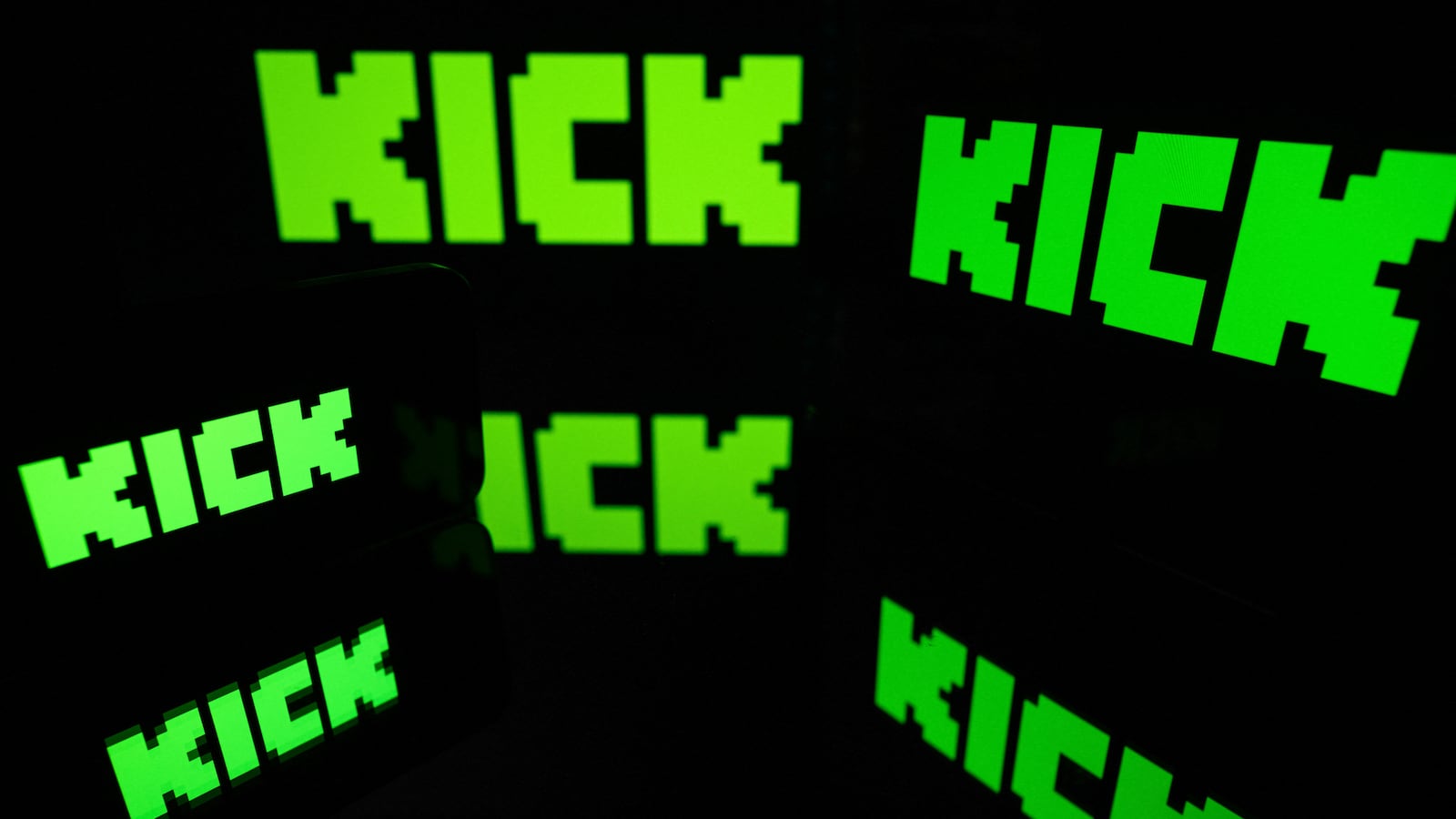 This photograph shows screens displaying the logo of the Australian live-streaming platform Kick, in Toulouse, southwestern France on August 21, 2025. French police are hoping an autopsy will help shed light on Raphael Graven, known online as "Jean Pormanove" or "JP", a 46-year-old man's death during a live-streamed event that a government minister said involved scenes of "absolute horror", a prosecutor said.