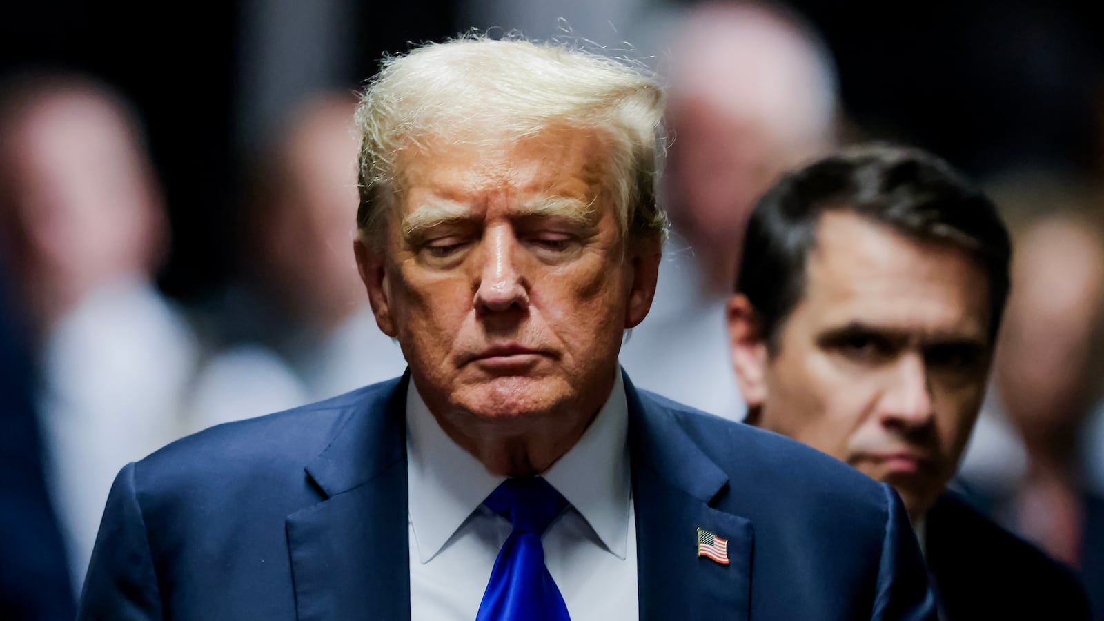 Former U.S. President Donald Trump departs the courtroom after being found guilty on all 34 counts in his hush money trial at Manhattan Criminal Court on May 30, 2024 in New York City.