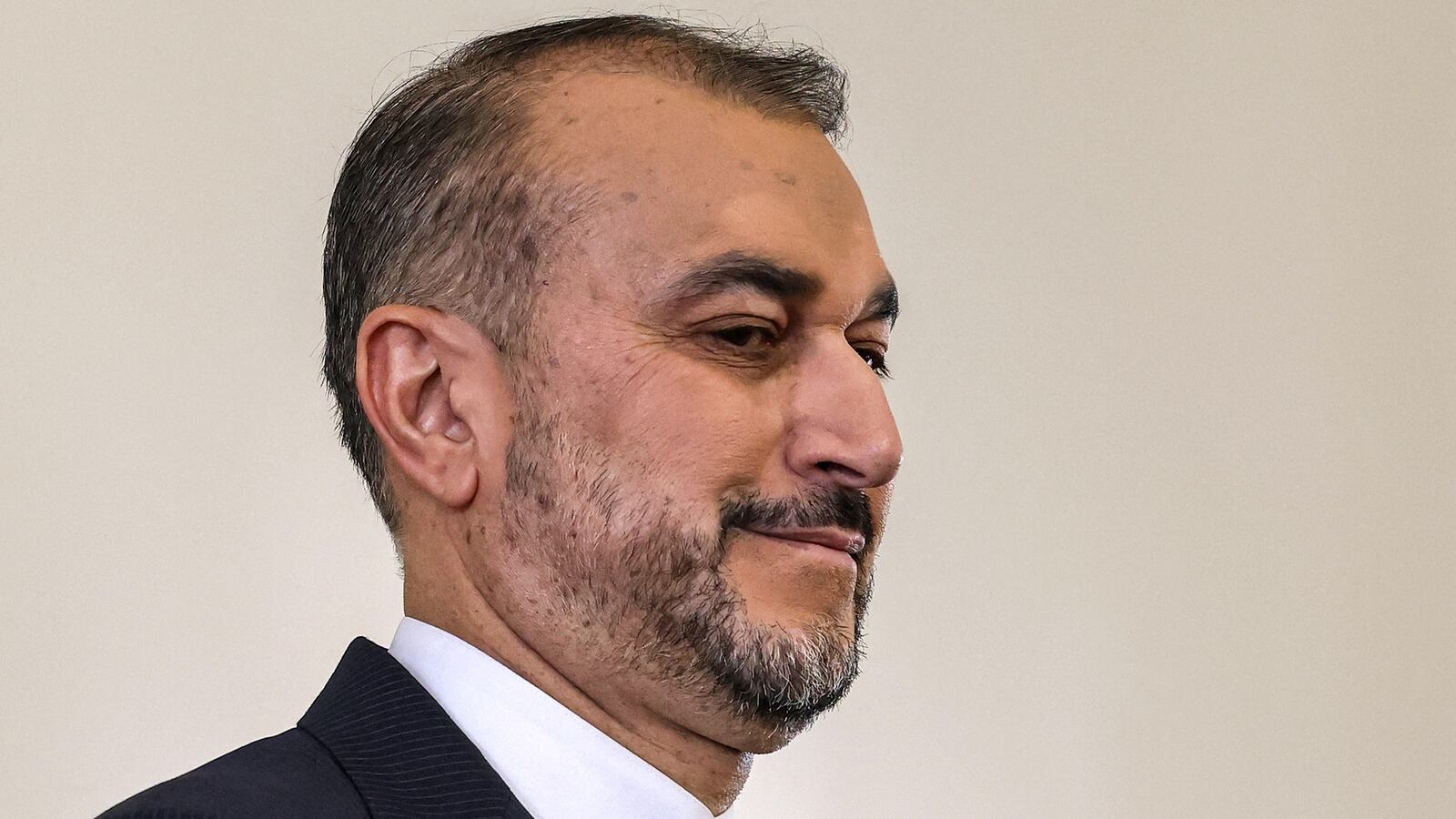 Iran's Foreign Minister Hossein Amir-Abdollahian applauds during a press briefing at his headquarters in Tehran on April 14, 2024.