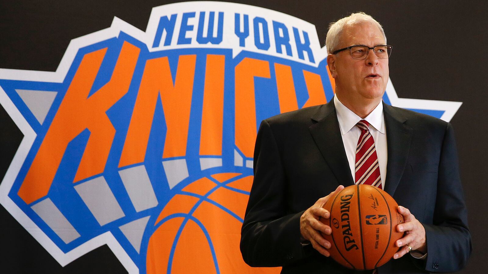Phil Jackson poses during a news conference announcing him as the team president of the New York Knicks basketball team at Madison Square Gardens in New York March 18, 2014.
