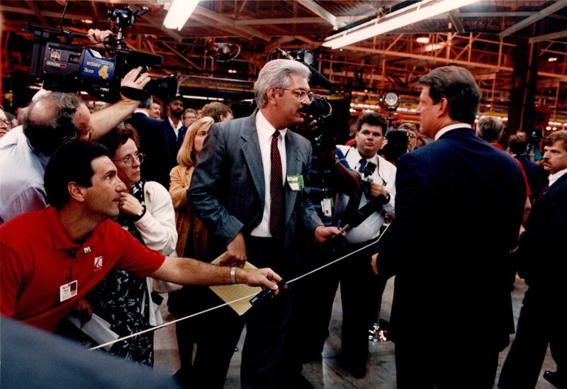 A photograph of Phil Williams questioning Vice President Al Gore during Gore's visit to General Motors' Saturn plant in Teneessee in 1993.