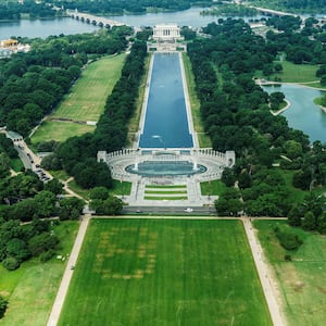 Authorities responded to what appeared to be a large tracing of the term 8647 into the grounds of the National Mall in Washington, D.C., June 11, 2026. A Reuters photographer captured the emerging image from atop the Washington Monument on the Mall's grass shortly before authorities arrived. The arrangement of the numbers was clearly an attempt to show 8647, though the 4 was not fully formed. Federal prosecutors on other occasions have said the term could indicate a threat to President Trump, the 47th U.S. president. REUTERS/Nathan Howard REFILE - QUALITY REPEAT     TPX IMAGES OF THE DAY