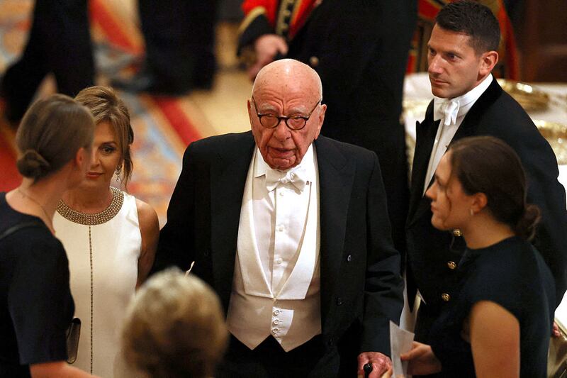 Australian businessman Rupert Murdoch and his companion Elena Zhukova attend a State Banquet at Windsor Castle, in Windsor, on September 17, 2025, during the second State Visit of US President Donald Trump. US President Donald Trump arrived in Britain for an unprecedented second State Visit, with the UK government rolling out a royal red carpet welcome to win over the mercurial leader. (Photo by Phil Noble / POOL / AFP) (Photo by PHIL NOBLE/POOL/AFP via Getty Images)