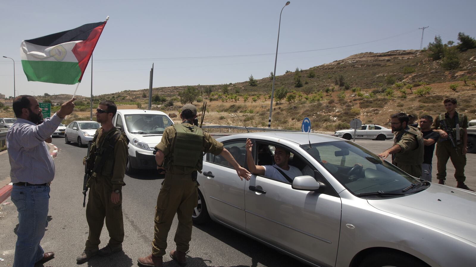 articles/2013/08/12/israeli-bypass-roads-separate-but-unequal/separate-roads-openz_mya9ip