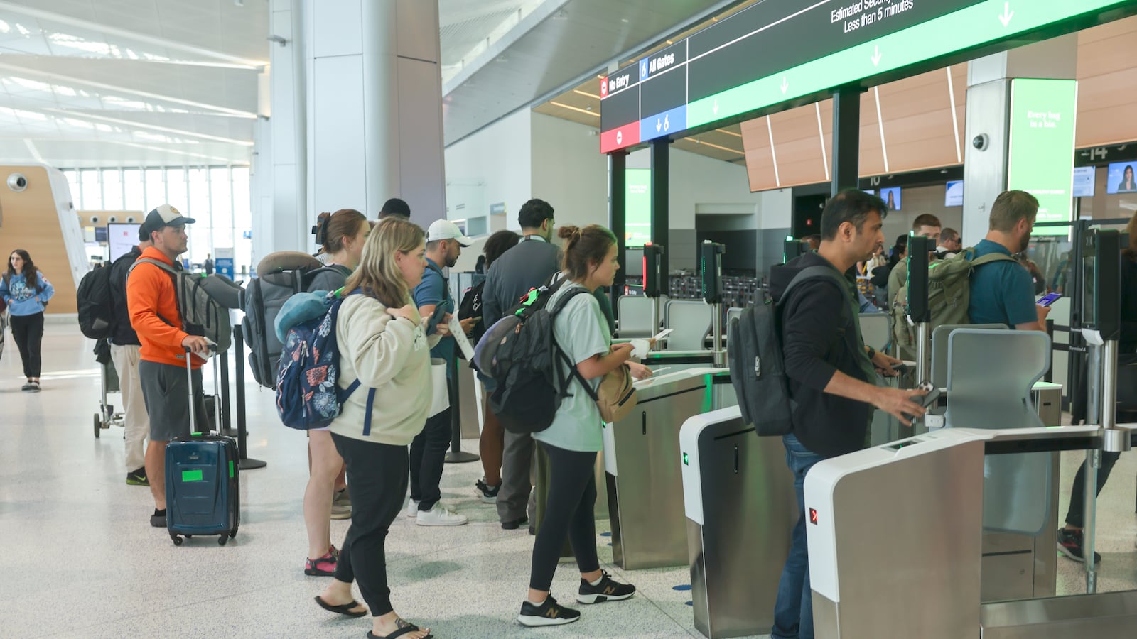 Passengers stand in line at Newark Liberty International Airport on June 2.