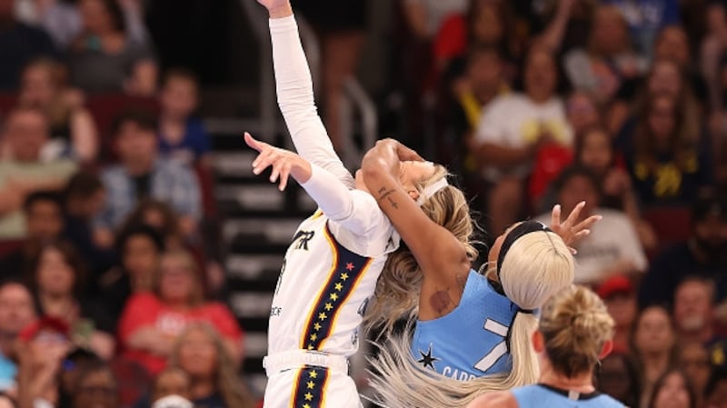 Sophie Cunningham #8 of the Indiana Fever is fouled by DiJonai Carrington #7 of the Chicago Sky during the first half at United Center on August 08, 2026 in Chicago, Illinois