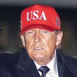 President Donald Trump waves to the media after landing aboard Air Force One on March 1, 2026 at Joint Base Andrews, Maryland.