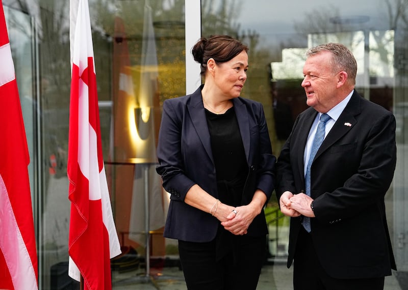 Greenland's Foreign Minister Vivian Motzfeldt and Denmark's Foreign Minister Lars Loekke Rasmussen pose at Denmark's  embassy in Washington D.C. on January 14, 2026 where they prepare for a meeting with the US Vice-President and the US Foreign Minister later in the day. Denmark will beef up its military presence in Greenland "from today", the defence ministry said January 14, 2026, just before high-stakes talks were to start in Washington over the US President's threats to take over the Arctic island. (Photo by Mads Claus Rasmussen / Ritzau Scanpix / AFP via Getty Images) / Denmark OUT