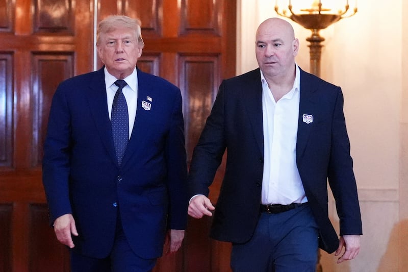 President Donald Trump walks with UFC president and CEO Dana White through the Cross Hall of the White House before attending the UFC Freedom 250 fights on the South Lawn of the White House, marking his 80th birthday on Sunday, June 14, 2026.