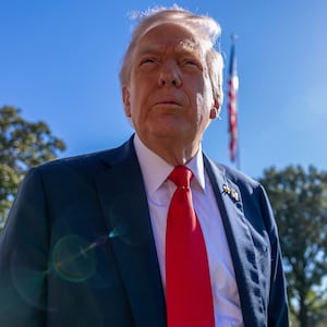 President Donald Trump talks to the media before heading to Marine One on the south lawn of the White House on October 05, 2025 in Washington, DC.