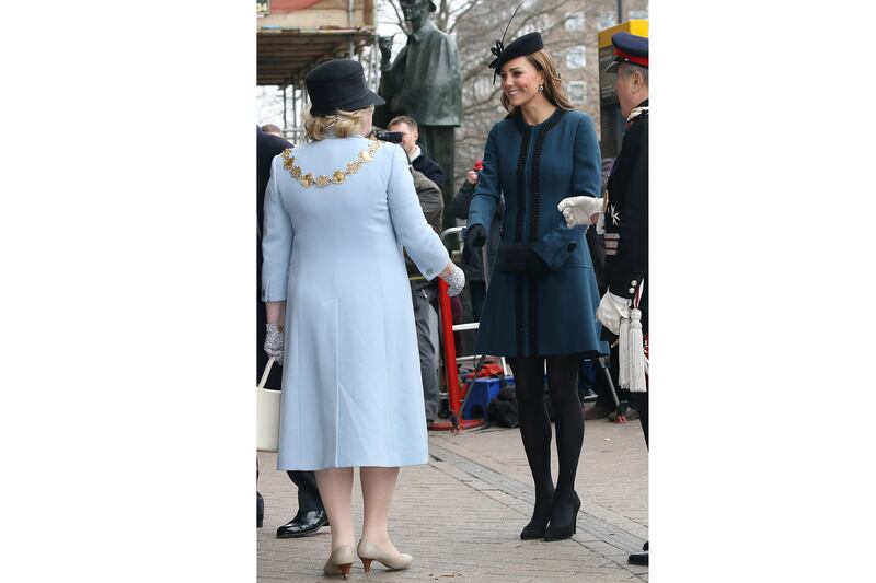articles/2013/03/20/kate-middleton-wears-baby-on-board-button-as-she-takes-subway-with-queen/130320-sykes-queen-duchness-underground-3_mdnucw