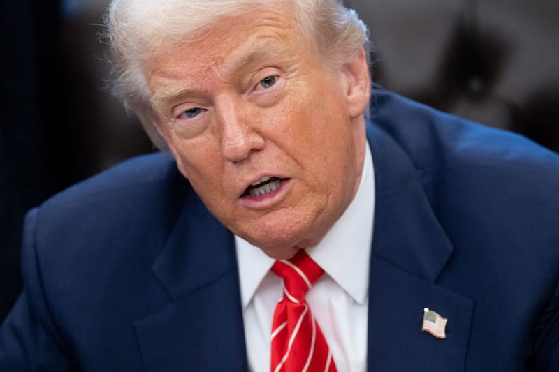 US President Donald Trump speaks with the media after signing a funding bill to end a partial government shutdown in the Oval Office of the White House in Washington, DC, February 3, 2026.