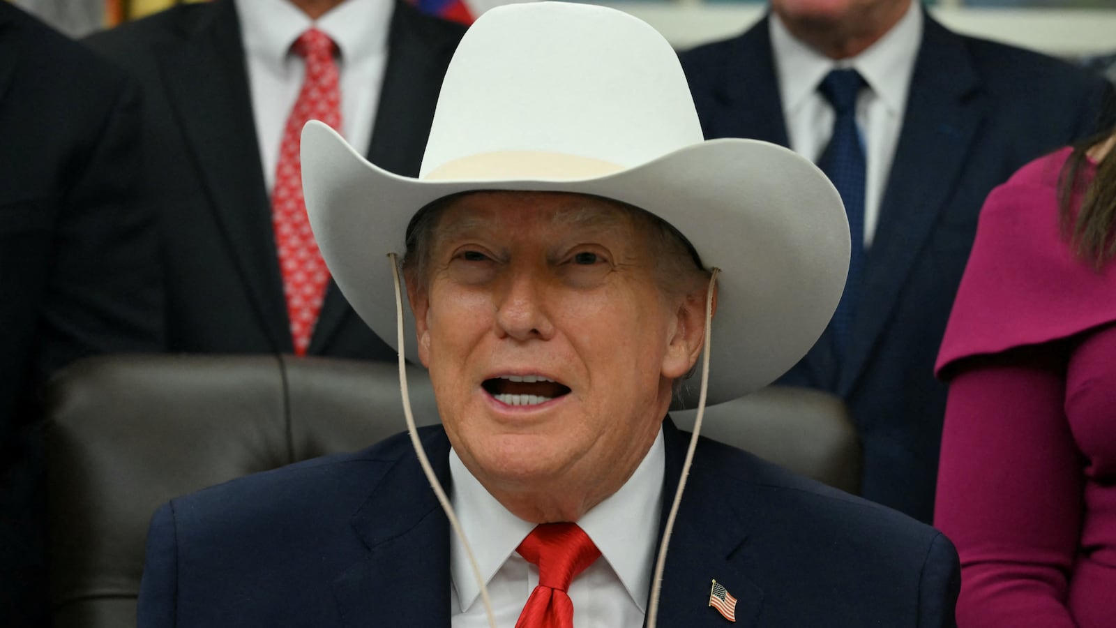 Donald Trump wears a cowboy hat during a bill signing ceremony in the Oval Office of the White House in Washington, DC, on December 12, 2025.