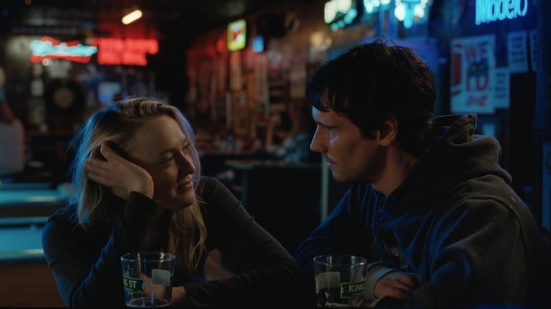 Wendy (Dakota Fanning) and Chuck (Cory Michael Smith) in “The Sun Never Sets.”