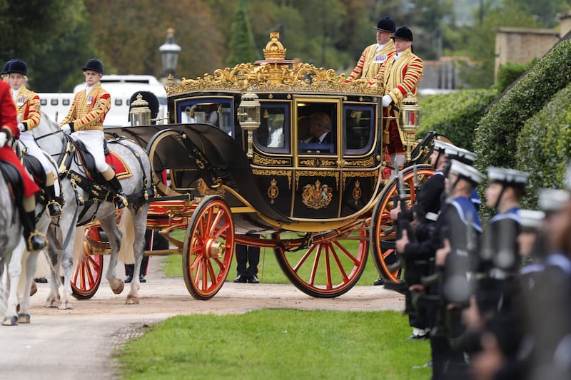 King Charles III and U.S. President Donald Trump sit in a carriage during a procession through Windsor Castle during the state visit by the President of the United States of America on September 17, 2025 in Windsor, England.