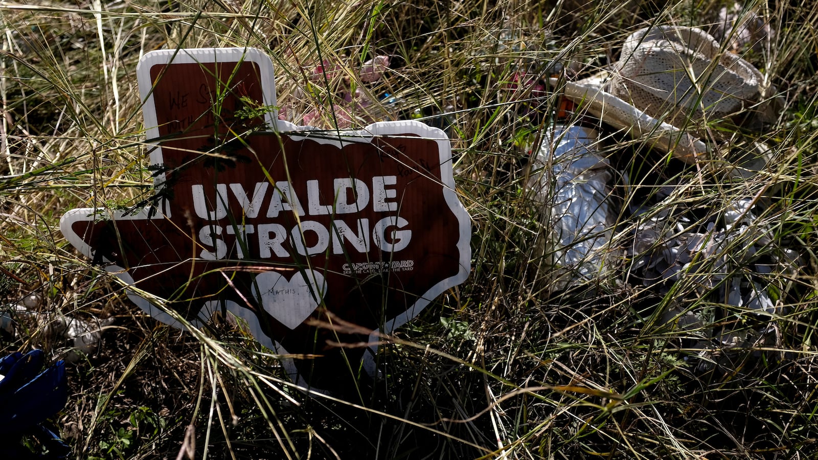 A sign with the shape of Texas is seen in a memorial outside the Robb Elementary, where a gunman killed 19 children and two teachers in the deadliest U.S. school shooting in nearly a decade, in Uvalde, Texas, U.S. November 27, 2022.