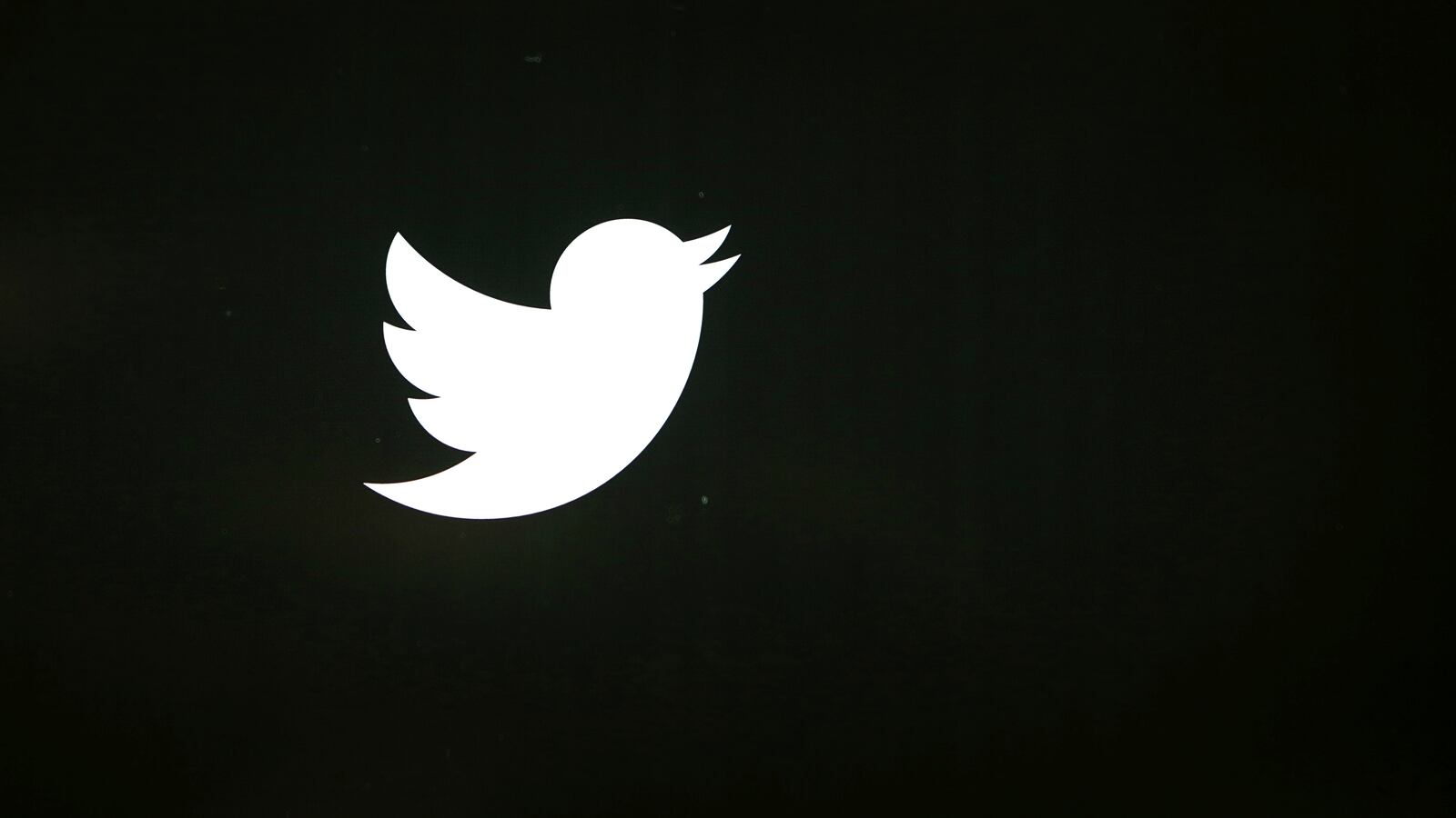 The Twitter logo against a black background.