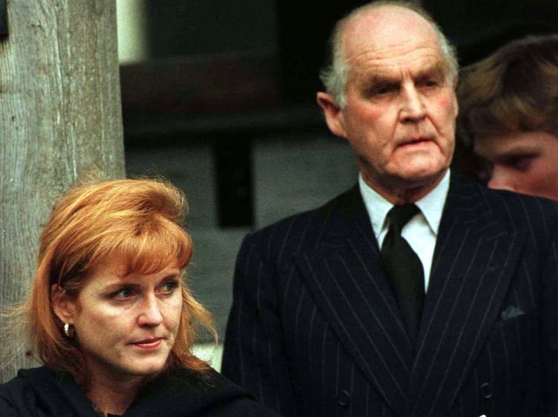 Major Ronald Ferguson and his daughter  Sarah Ferguson, the Duchess of York  (L) watch as the coffin of her grandmother Lady Elmhirst is loaded into the hearse December 19. The funeral took place at All saints Church and was attended by friends and family. REUTERS/Stringer