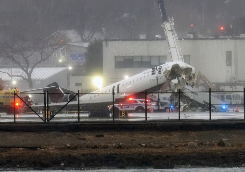 An Air Canada Express CRJ-900 sits on the runway at LaGuardia Airport on March 23, 2026. The pilot and co-pilot of the Air Canada jetliner were pronounced dead after their aircraft smashed into a Port Authority truck on the runway as they tried to take off in Queens on Sunday, March 22, 2026.