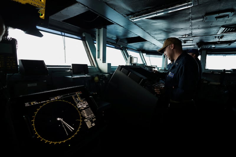 A U.S. Navy sailor works during his day-shift at the flight-bridge of the USS Dwight D. Eisenhower (CVN 69) aircraft carrier in Southern Red Sea, Middle East,