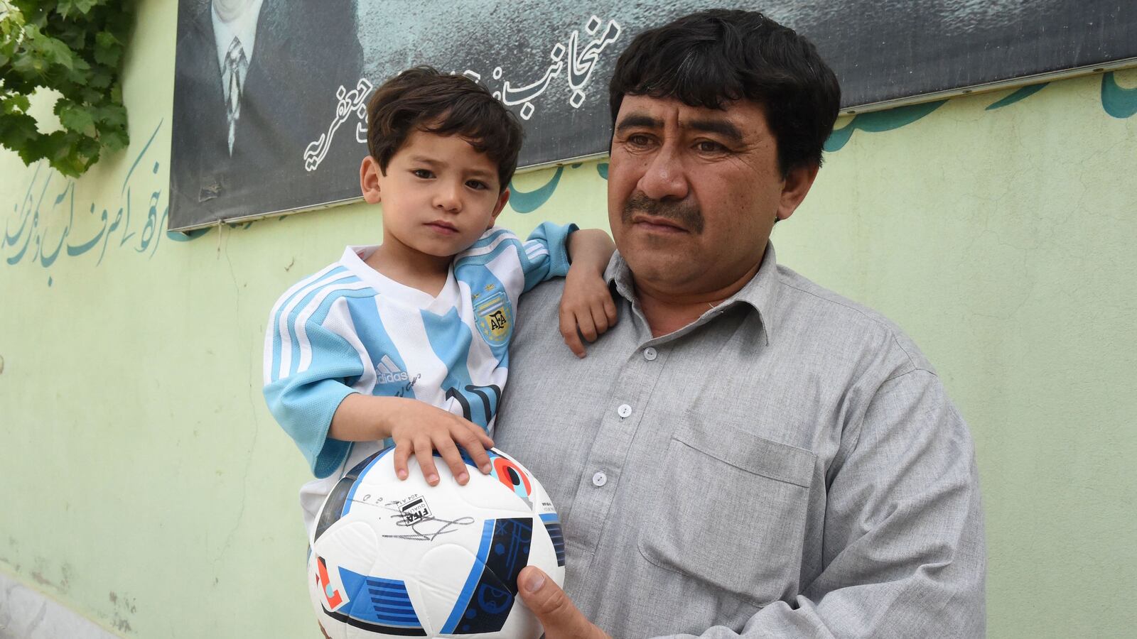 videos/2016/05/03/kid-with-plastic-messi-jersey-had-to-flee-afghanistan/160503-Place-messi-kid-flees-afghanistan_aqzeee