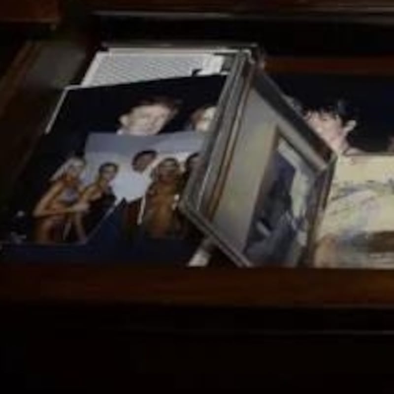 Epstein's desk featuring a picture of Trump and Epstein.