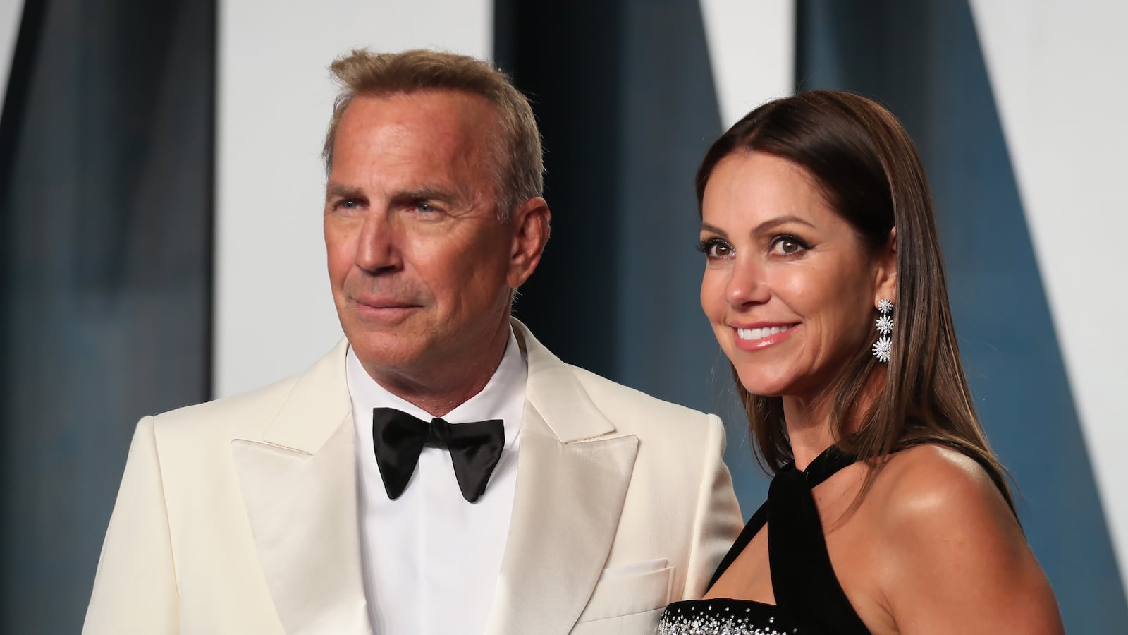 Kevin Costner and Christine Baumgartner arrive at the Vanity Fair Oscar party.