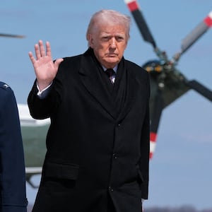 U.S. President Donald Trump gestures as he boards Air Force One to travel to Dover Air Force Base, as he departs from Joint Base Andrews, Maryland, U.S., March 18, 2026. REUTERS/Kylie Cooper