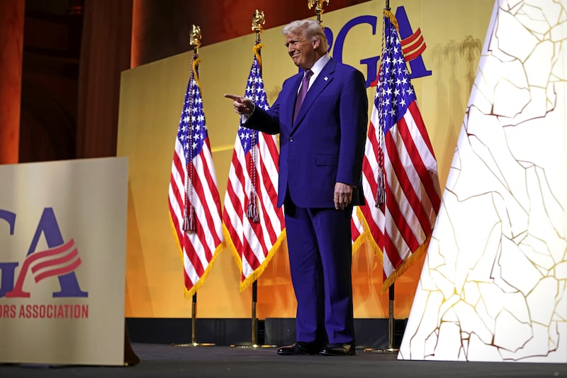 Trump walks on stage to speak during a meeting of the Republican Governors Association at the National Building Museum in Washington, DC, on February 20, 2025.