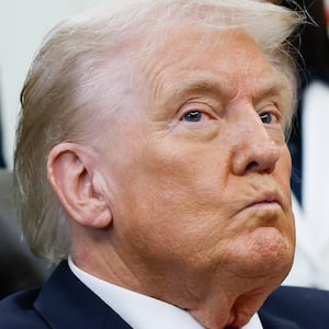 WASHINGTON, DC - OCTOBER 16: U.S. President Donald Trump listens to other speakers after delivering remarks during an event in the Oval Office of the White House on October 16, 2025 in Washington, DC. Trump outlined plans to expand vitro fertilization (IVF) access by encouraging workplace benefits to include access to IVF and infertility coverage. (Photo by Kevin Dietsch/Getty Images)