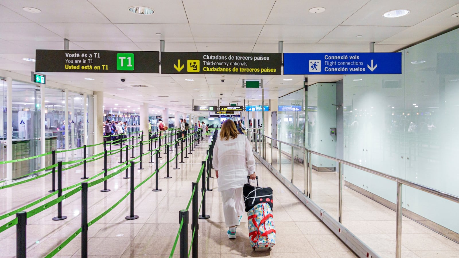Barcelona, Spain, Catalonia, Barcelona-El Prat Josep Tarradellas Airport BCN, arriving passenger, customs signs in three languages English Catalan, designated lines.