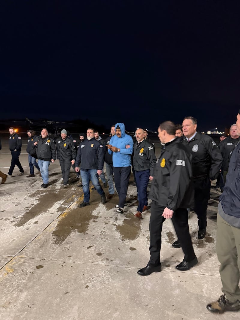 Nicolas Maduro was escorted on the tarmac at Stewart Airport in upstate New York by a phalanx of agents including, holding Maduro's left arm, Terry Cole, the Trump nominee to be DEA administrator.
