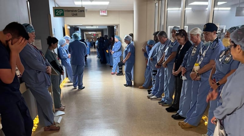 Alex Pretti's colleagues hold a moment a moment of silence at Minneapolis VA Health Care System hospital, in Minneapolis, Minnesota.