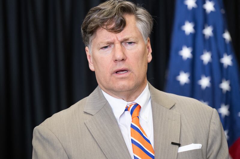 Deputy Secretary of State Christopher Landau speaks to the press after welcoming the first group of Afrikaners from South Africa to arrive for resettlement, at Washington Dulles International Airport in May 2025.